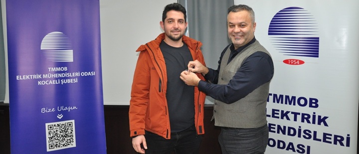 Yeni üye Mustafa Gençtürk`e rozeti takıldı